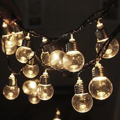 a bunch of light bulbs that are on a string