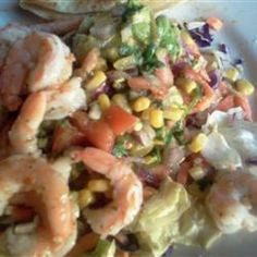 shrimp and corn salad on a white plate