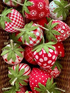 red and white decorated strawberries in a basket