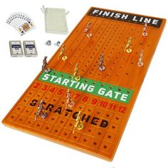 an orange board game set up with matching pieces and instructions for playing the finish line