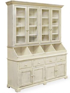 an antique white china cabinet with glass doors and drawers on the front, side view