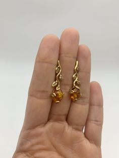 Gold Amber Earrings set with Natural Amber in a top grade & brownish-yellow translucent resin, at 10x8mm each (6 Ct a pair).Gold Vermeil: 18k Gold over Solid 925 Sterling Silver ☞ made to last.Click here for ☞ Matching RingClick here for ☞ Matching PendantDetails:• Natural Amber in a top grade & a stunning honey color• Amber: 10x8mm, 6 Ct a pair, cabochon cut• Lever Back Closure - "English Lock"• Dimensions: Length 30mm, Width 10mm• 18k Gold Vermeil❀ Each Natural Gem is unique & will have Slight Amber Citrine Earrings With Ear Wire, Yellow Citrine Earrings For Formal Occasions, Formal Yellow Citrine Earrings, Amber Drop Earrings For Formal Occasions, Amber Citrine Teardrop Earrings, Amber Earrings For Pierced Ears For Formal Occasions, Formal Amber Citrine Earrings, Gold Baltic Amber Jewelry For Anniversary, Amber Drop Earrings With Ear Wire