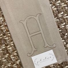 A personalized guest towel is an affordable luxury that makes a great hostess gift, housewarming gift, or get one for yourself to freshen up your kitchen or bathroom. Towel is personalized with a single 6" initial in the Romanesque font. You can choose 2 colors - outline color and line fill color. Towel in picture has khaki thread for the outline and white thread for the line fill. You can also choose the same thread color for both fill and outline if you like. Made from flat weave, 100 percent cotton, with a hanging tab in the upper corner. Approximate 18"x 28" Available in white or oatmeal color Mint Backpack, Tan Towels, Monogrammed Apron, Monogram Kids, Pink Raincoat, Its A Boy Banner, Monogram Backpack, Monogram Towels, Towel Wrap