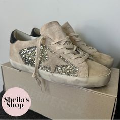 Golden Goose Deluxe Brand Ggdb Glitter & Suede Super-Star Sneakers Eu Size 37 / Usa Women’s Size 7 / Uk Size 4 Condition: New In Box, Guaranteed Authentic Color: Platinum / Beige / Black Suede Upper / Rubber Sole Comes With Original Box, Dust Bag And Passport Made In Italy Msrp $625 Cheaper On Www.Sheilasshop.Com Golden Goose Purestar, Golden Goose Sneakers Glitter, Golden Goose Sneakers Velcro, Unique Golden Goose, Golden Goose Deluxe Brand, Star Sneakers, Golden Goose, Black Suede, Womens Shoes Sneakers