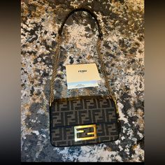 Fendi Bag In Great Used Condition Bag Comes With Box, Dust Bag, Receipt, Bag Has Slightly Wear Signs, Bag Hardware Has Normal Wear Like Any Other Pre Owned Bag!! Feel Free To Request More Pictures. Https://Www.Fendi.Com/Us-En/Woman/Bags/Mini-Bags/Baguette-Mini-Brown-Ff-Jacquard-Fabric-Bag-8bs017a6v5f17u4?Gad_source=1&Gclid=Eaiaiqobchmil_dh8mcbhwmvyyotbh0ilw8eeaqyayabegiyupd_bwe&Gclsrc=Aw.Ds Fendi Baguette Mini, Bag Hardware, Fendi Bag, Fendi Baguette, Fabric Bag, Bags Mini, Jacquard Fabric, Mini Bags, Fendi Bags