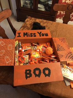 a box filled with candy sitting on top of a table