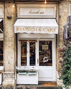 an old building with a white awning on it's front door and windows