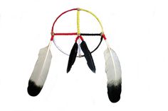 an image of a dream catcher with feathers hanging from it's side on a white background