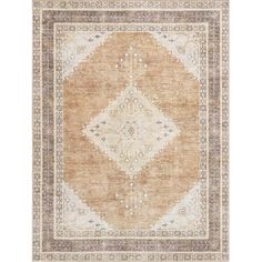 an area rug with brown and beige colors on the floor, including a large diamond design