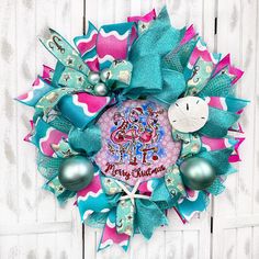 a colorful wreath with some ornaments on it