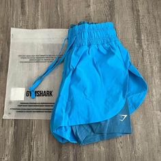 New Gymshark 2-In-1 Running Shorts. Size Xs Blue Athletic Shorts For Gym And Summer, Sporty Light Blue Shorts For Beach, Blue Sporty Athletic Shorts For Beach Season, Blue Athleisure Bottoms For Beach Season, Light Blue Moisture-wicking Bottoms For Summer, Blue Training Shorts For Summer, Blue Sporty Shorts For Beach Season, Blue Sporty Shorts For Summer, Sporty Blue Shorts For Beach Season