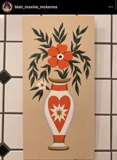 a painting of a vase with flowers in it on a tile wall next to black and white tiles