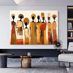 an abstract painting hangs on the wall above a modern coffee table in a living room