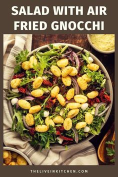 salad with air fried gnocchini in a bowl on top of a table