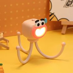 a toy with a light in it's mouth