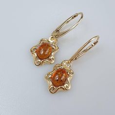 Amber Earrings, Gold Gemstone Earring, Dangle hanging crystal earrings, Christmas gift for Her.  Small and cute Baltic Amber dangle earrings for women, lever back closure. Gold plated Sterling silver 925, with stamps. Weight about 2.89 gr. length about 3 cm.  This item was made of natural Baltic Amber. All the amber used in my jewelry is collected in my home country Lithuania.  I sell only genuine,  real, not pressed, authentic, natural Baltic Amber. Item may have natural imperfections. Pierced Yellow Gold Crystal Earrings As Gift, Yellow Gold Pierced Crystal Earrings As Gift, Yellow Gold Pierced Crystal Earrings For Gift, Teardrop Crystal Earrings Gift, Teardrop Crystal Earrings For Pierced Ears Gift, Amber Dangle Earrings For Anniversary, Amber Dangle Earrings For Formal Occasions, Gold Crystal Earrings With Lever Back For Gifts, Gift Oval Hoop Earrings With Lever Back