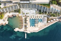 an aerial view of the resort and its surrounding area, with swimming pool in the foreground