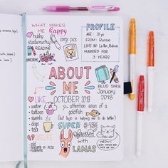 an open notebook with doodles and pens on it