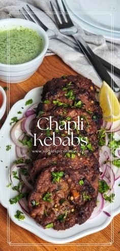 the cover of chapi kebabs is shown on a plate with onions and cilantro