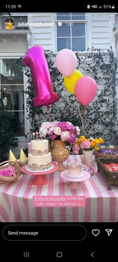 a table topped with lots of cake and balloons