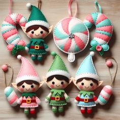 christmas ornaments made to look like elves with candy canes and lollipops