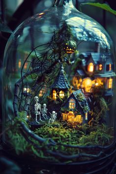 a glass dome filled with halloween decorations