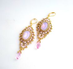 Openwork lacy large pink crystal earrings in Tudor style. Long earrings with pink crystal cabochon and drop pendant. Made by hand with a hook and metallic gold and very strong thread. The cabochon size is 13 x 18 mm. Hook Earring Length : 7cm Width: 3 cm. These earrings will suit the bridesmaid or the bride herself. It is possible to make earrings in other colors. Created by the KeliaZ team Wrapping Stones, Pink Crystal Earrings, Tudor Style, Wire Wrapping Stones, Drop Pendant, How To Make Earrings, Pink Crystal, Hook Earrings, Long Earrings