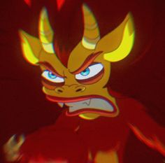 an animated image of a demon with blue eyes and yellow horns on his head, looking angry