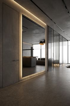 an empty room with large mirrors on the wall