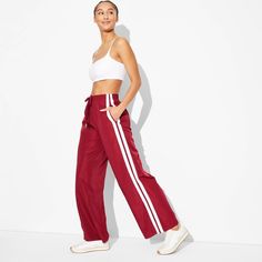 Full-length track pants from Wild Fable™ in a high-rise cut. Side pockets help keep small items handy. Made from soft and stretchy fabric in a relaxed fit. Full elastic waistband with drawstring helps keep it in place. If you're not satisfied with any Target Owned Brand item, return it within one year with a receipt for an exchange or a refund. Wild Fable™: A look for every story. Wide Leg Sweatpants, Shipt Shopper, Pants Large, Bottom Clothes, Wild Fable, Casual Fits, Stretchy Fabric, Small Items, Bottoms Pants