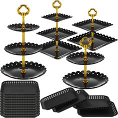 six tiered trays with gold handles and rings on each one, all in black