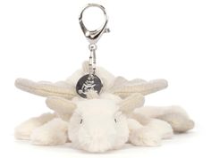 a white stuffed animal with a tag on it's ear