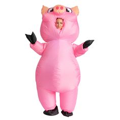 a woman in a pink pig costume is standing with her arms out and eyes closed