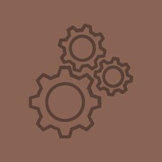 three gears on a brown background