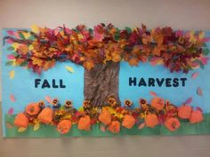 a bulletin board with leaves and flowers on it that says fall harvest written in large letters