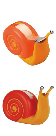 an orange and red snail toy sitting next to each other