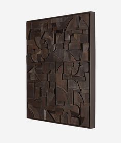 a wooden wall sculpture with various shapes and sizes