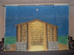 an image of a nativity scene on a wall in a room with carpeted flooring