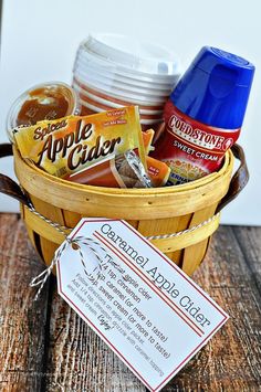 a basket filled with food sitting on top of a wooden table next to a tag