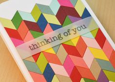 a handmade card with the words thinking of you written on it and colorful geometric shapes