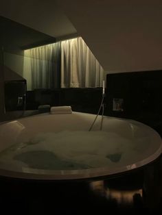 a large bath tub sitting inside of a bathroom