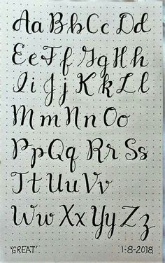 the upper and lower letters are drawn in black ink on a sheet of white paper