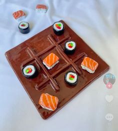 there are sushi on the chocolate tray