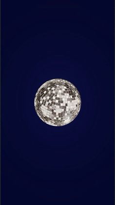 an abstract photo of a white ball on a dark blue background in the middle of the night