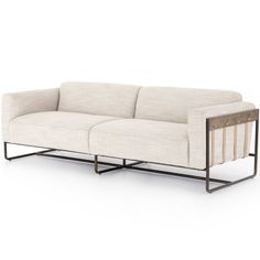 a white couch sitting on top of a metal frame