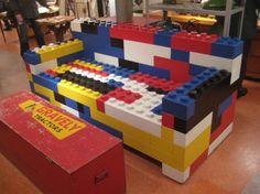 a couch made out of legos in a store