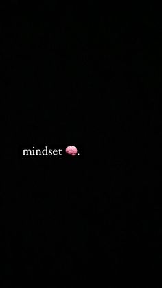 the word mindset is written in white on a black background with a pink dot