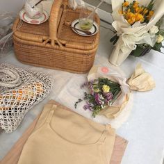 the table is covered with flowers and other items