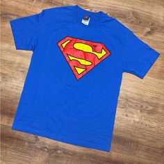 Vintage 2003 Superman T-Shirt Size Large. 21 Inches Pit To Pit. 29 Inches Length. 9.5/10 Condition. Like New Any Questions Feel Free To Ask Will Ship Within 24 Hours Of Purchase 4208 Blue Superhero Short Sleeve Top, Blue Short Sleeve Superhero Tops, Blue Superhero Crew Neck Top, Vintage Superman, Superman T Shirt, Shirts Vintage, Vintage Shirts, American Vintage, Superman