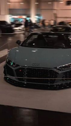 an audi sports car is parked in a parking garage